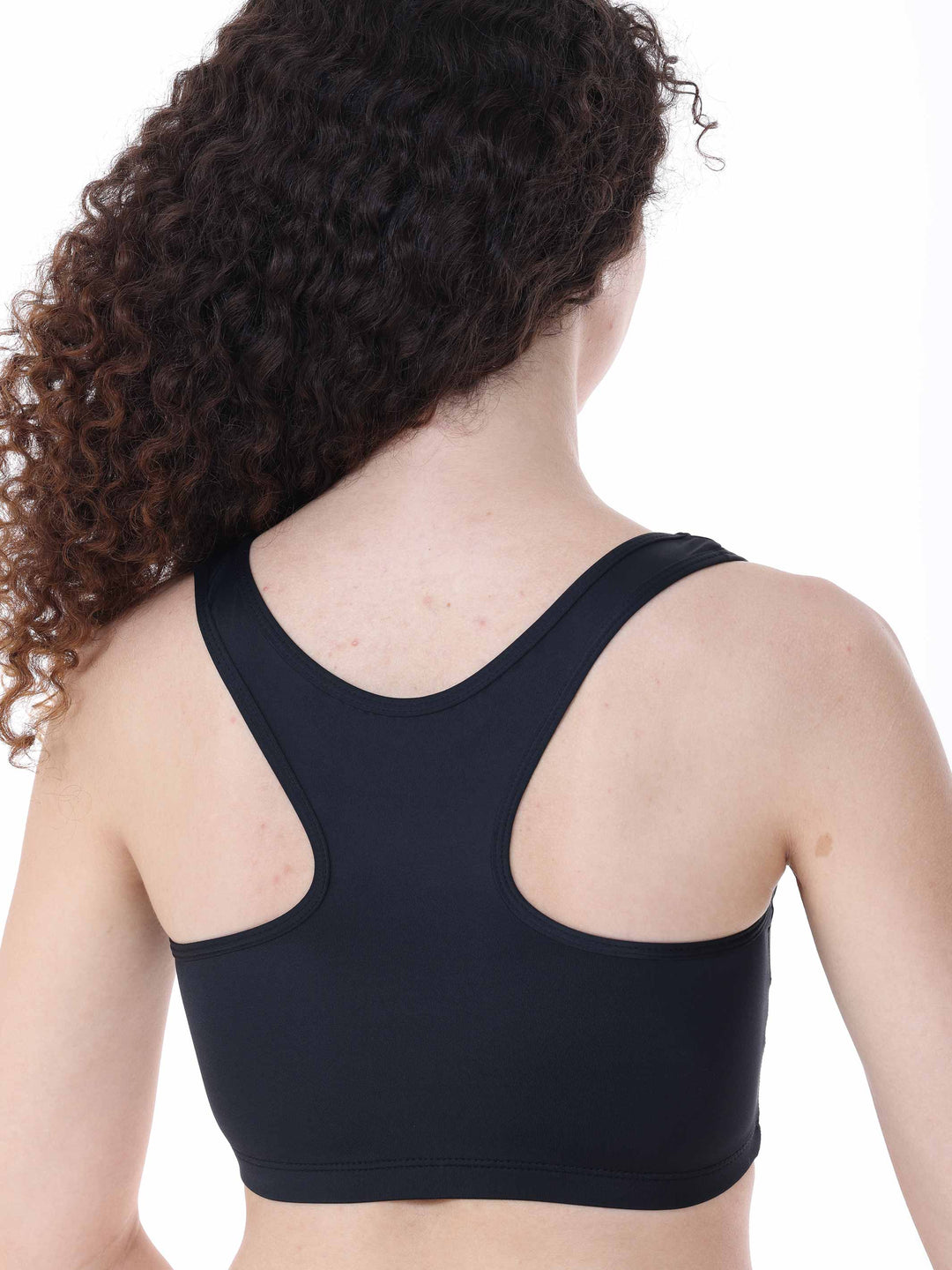 Détail du dos nageur d’un top brassière noir – design sportif et élégant pour danseuse.