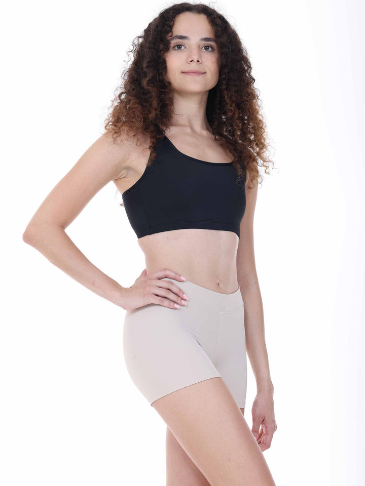 Profil de danseuse en brassière noire dos nageur – haut technique idéal pour répétitions ou yoga.
