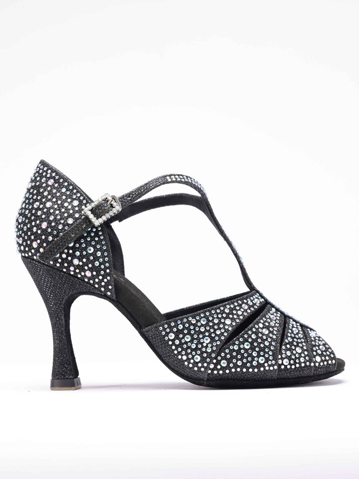Chaussures de danse latine et salsa pour femme, modèle Estelle, design T-strap orné de strass scintillants, y compris sur la boucle, forme avant étroite avec ouvertures, talon rétro de 8,5 cm, couleur noire - vue de côté