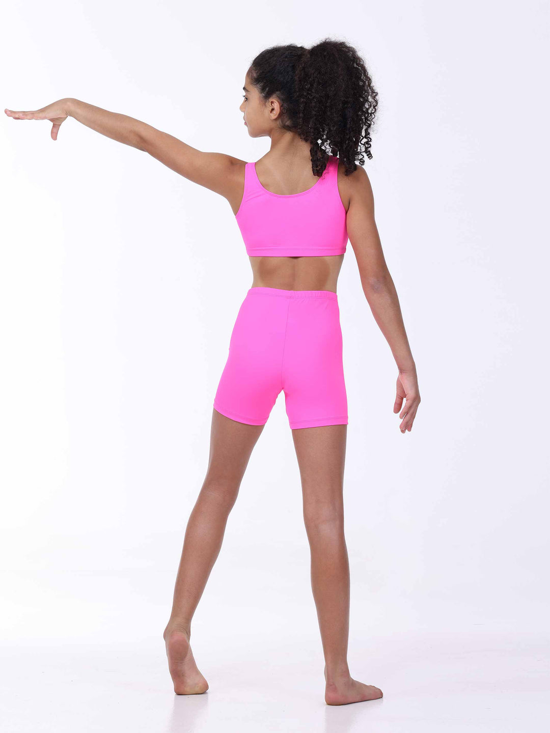 Vue arrière de profil – tenue de danse ou fitness pour fille en rose vif.