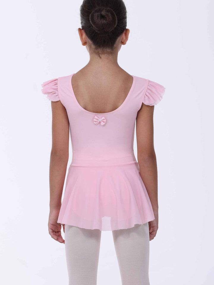 Vue de dos d’une robe de danse rose clair pour fille – nœud décoratif et jupe fluide.